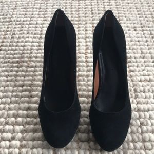 Black suede pumps